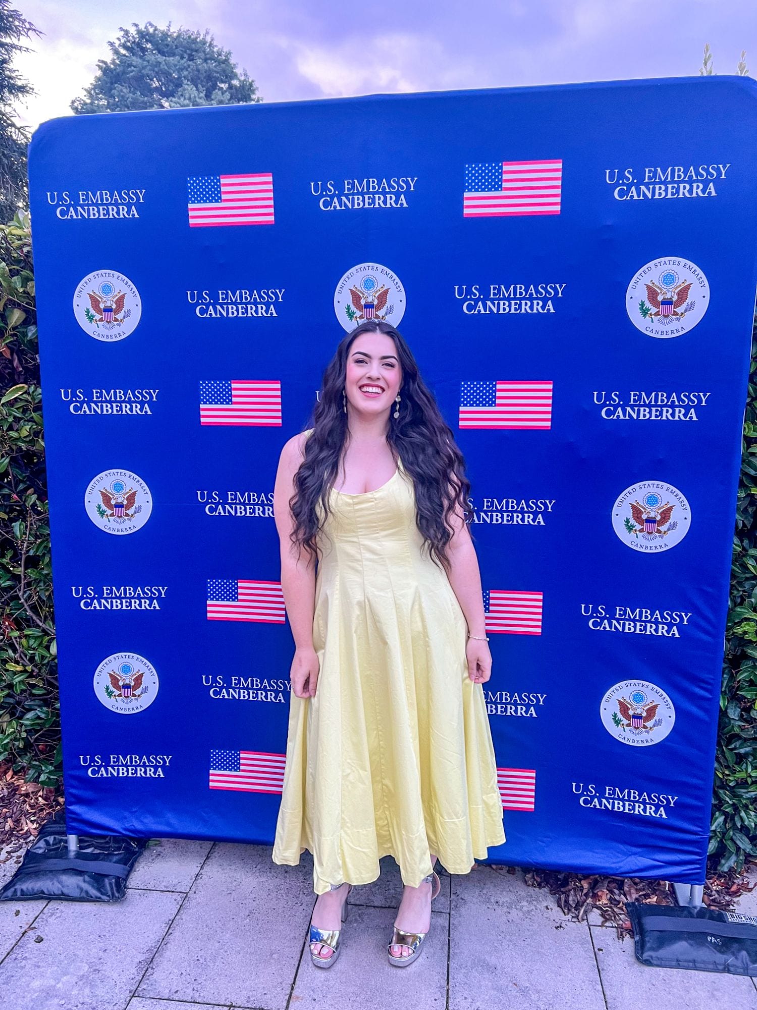 Dana at a U.S. Embassy Canberra event in a yellow dress